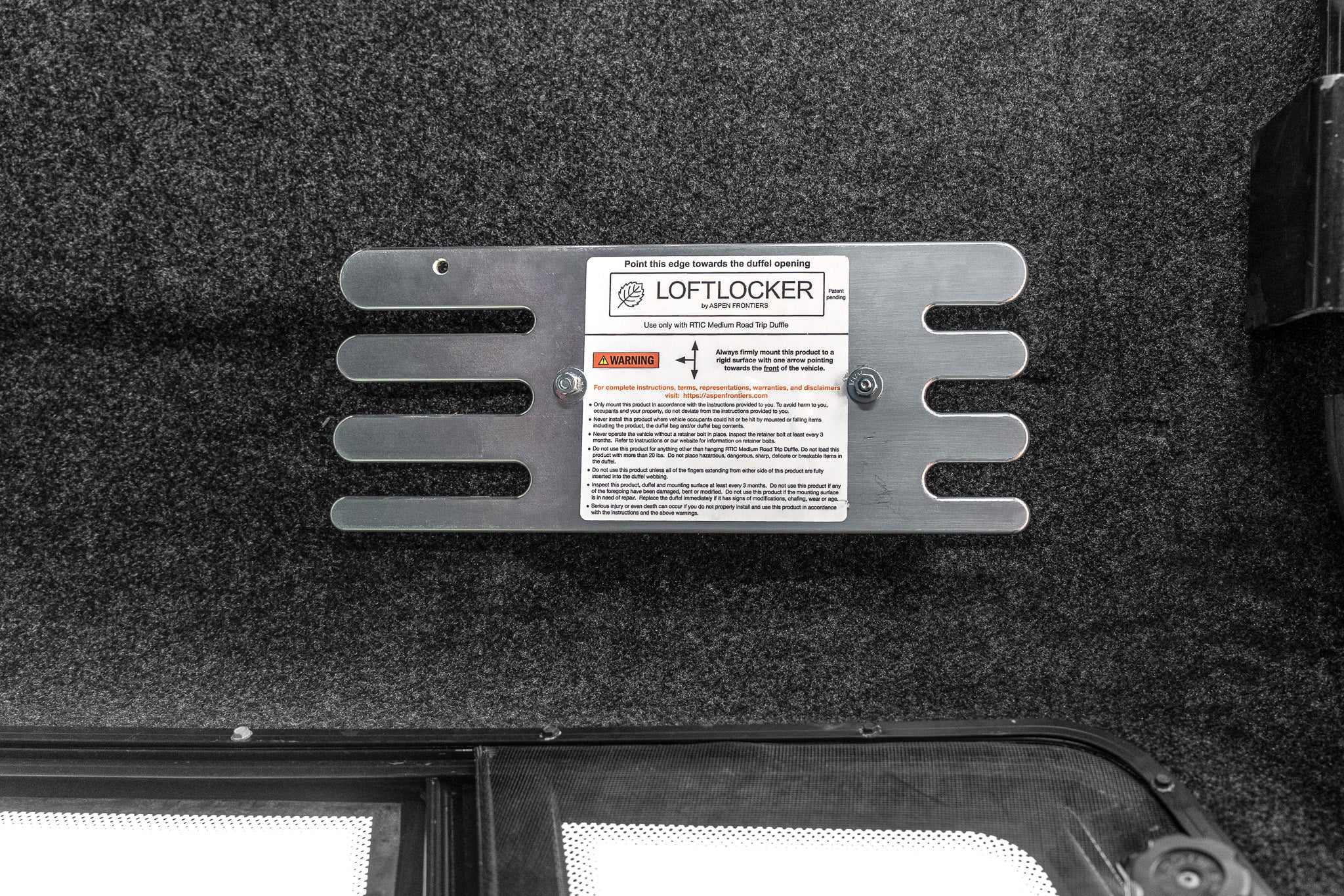 LoftLockers hang duffels in truck toppers for a well-organized truck bed camping setup