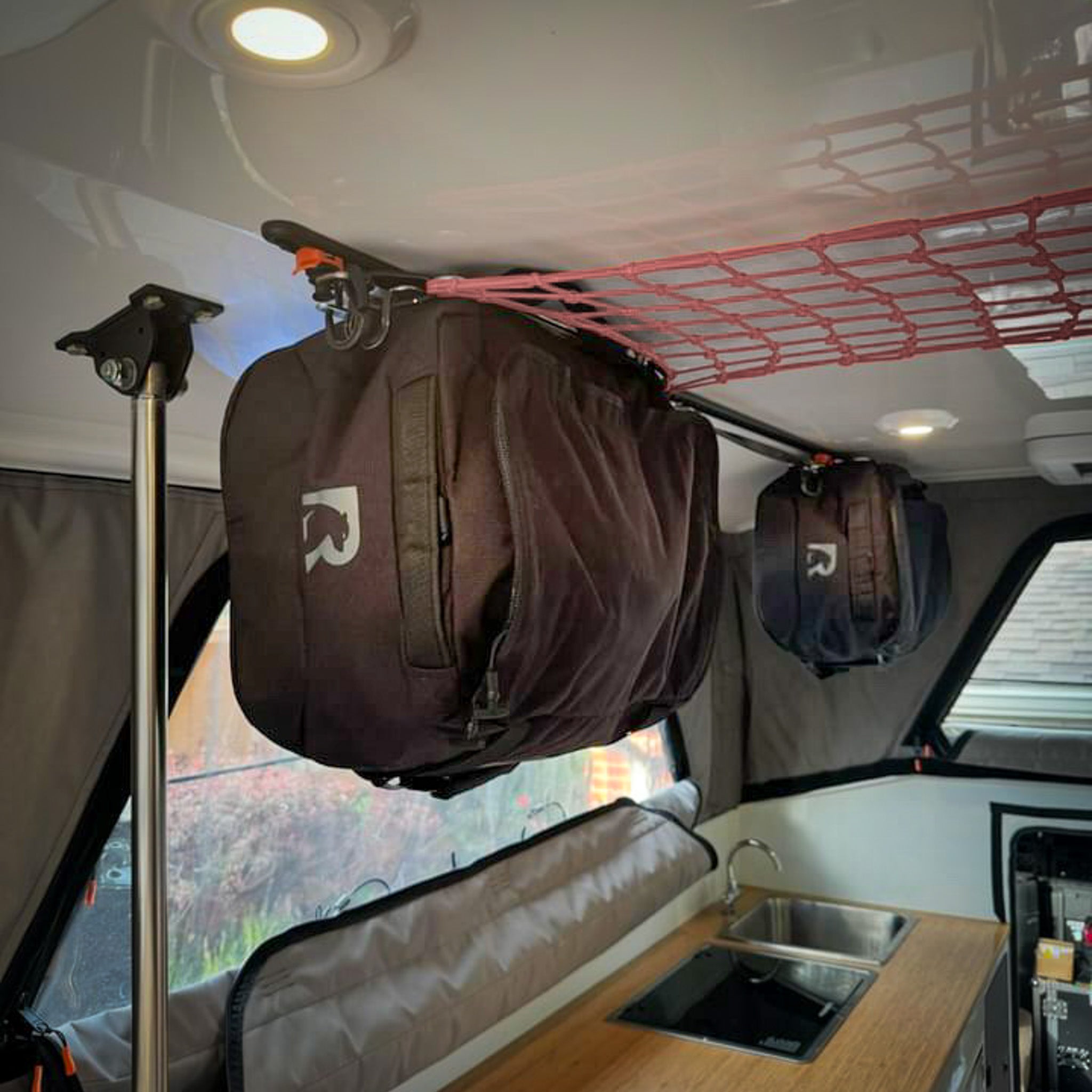 Supertramp Camper hanging duffels as cabinets