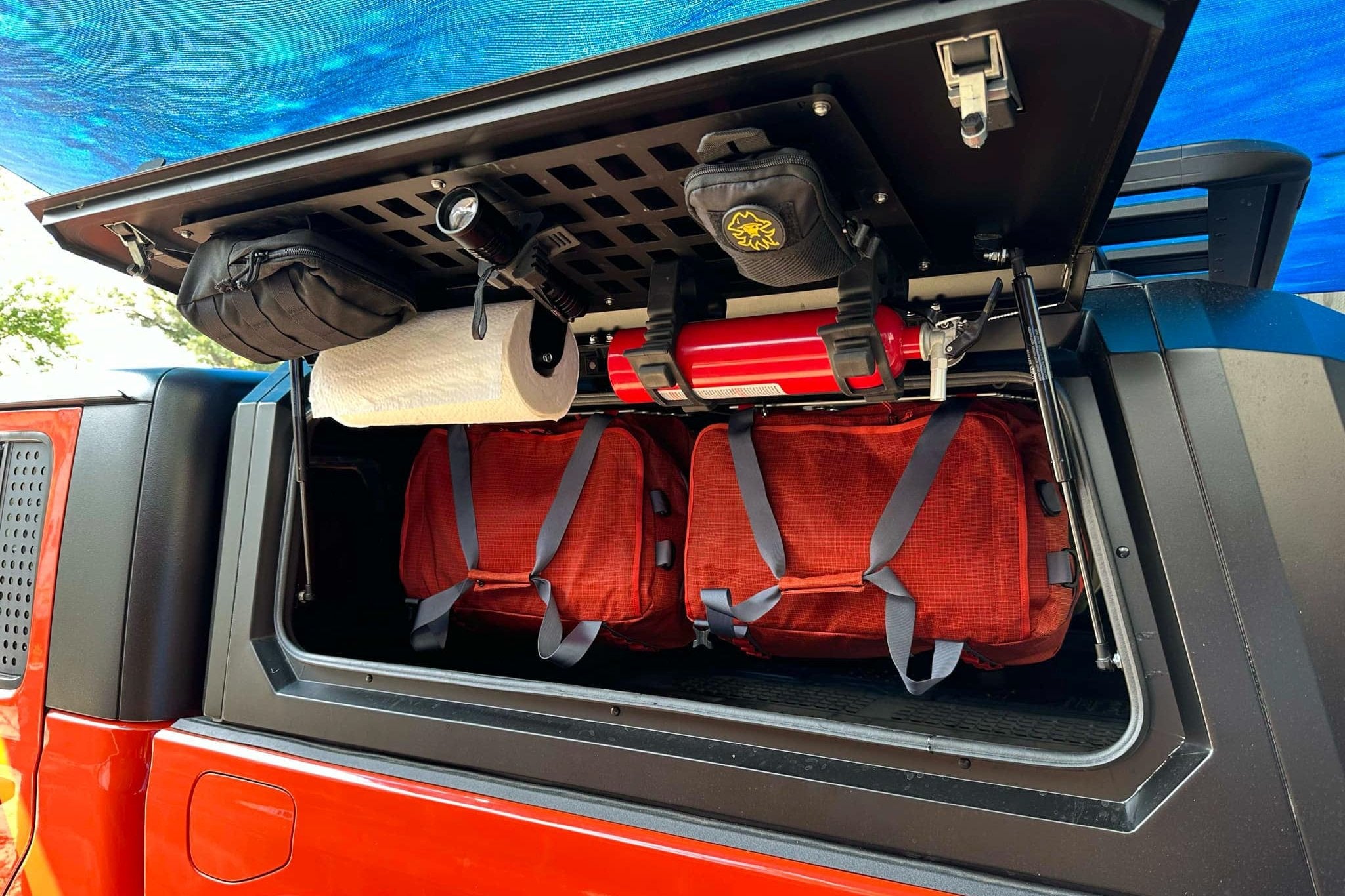 Hang duffel bags in overland camper shell for storage (Smart Cap shown)